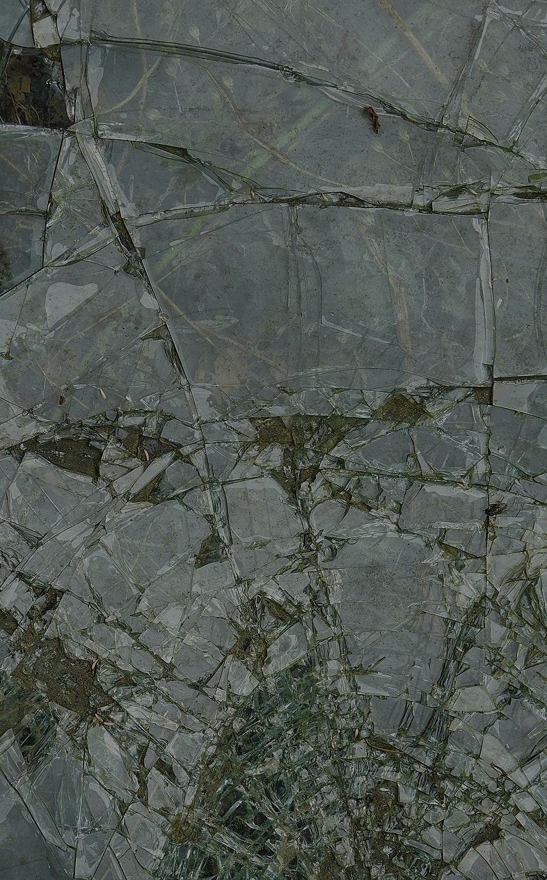 Man in a suit adjusting his collar