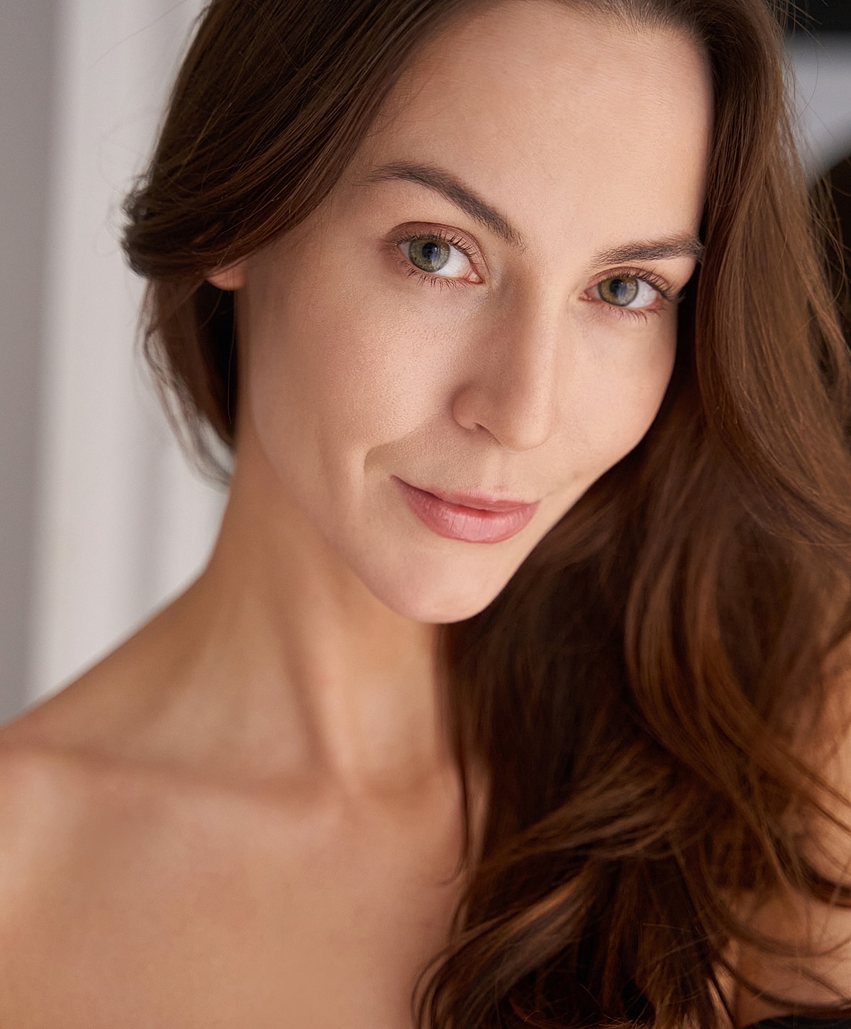 Portrait of a woman with long, flowing hair.