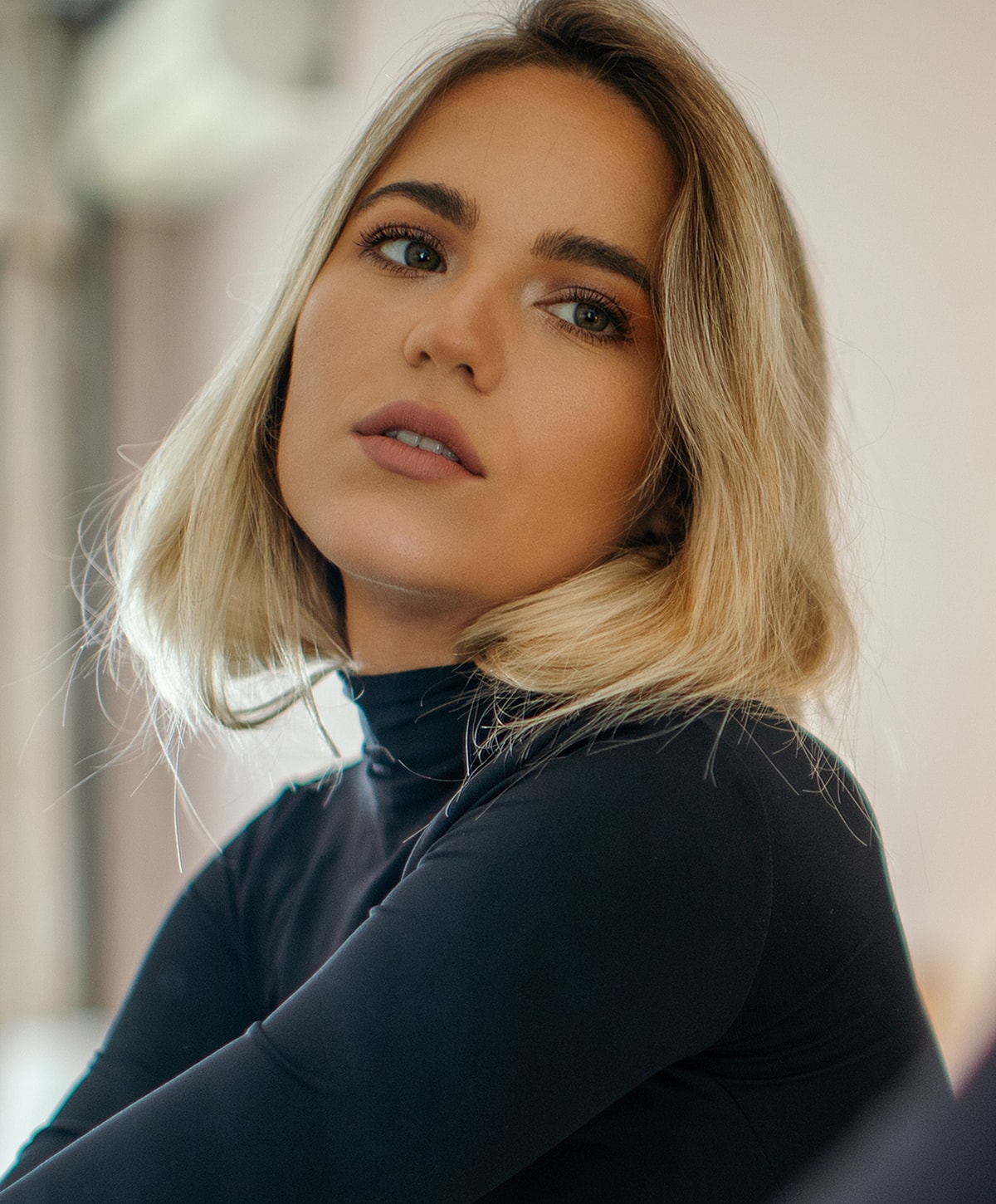 Portrait of a woman with blonde hair.