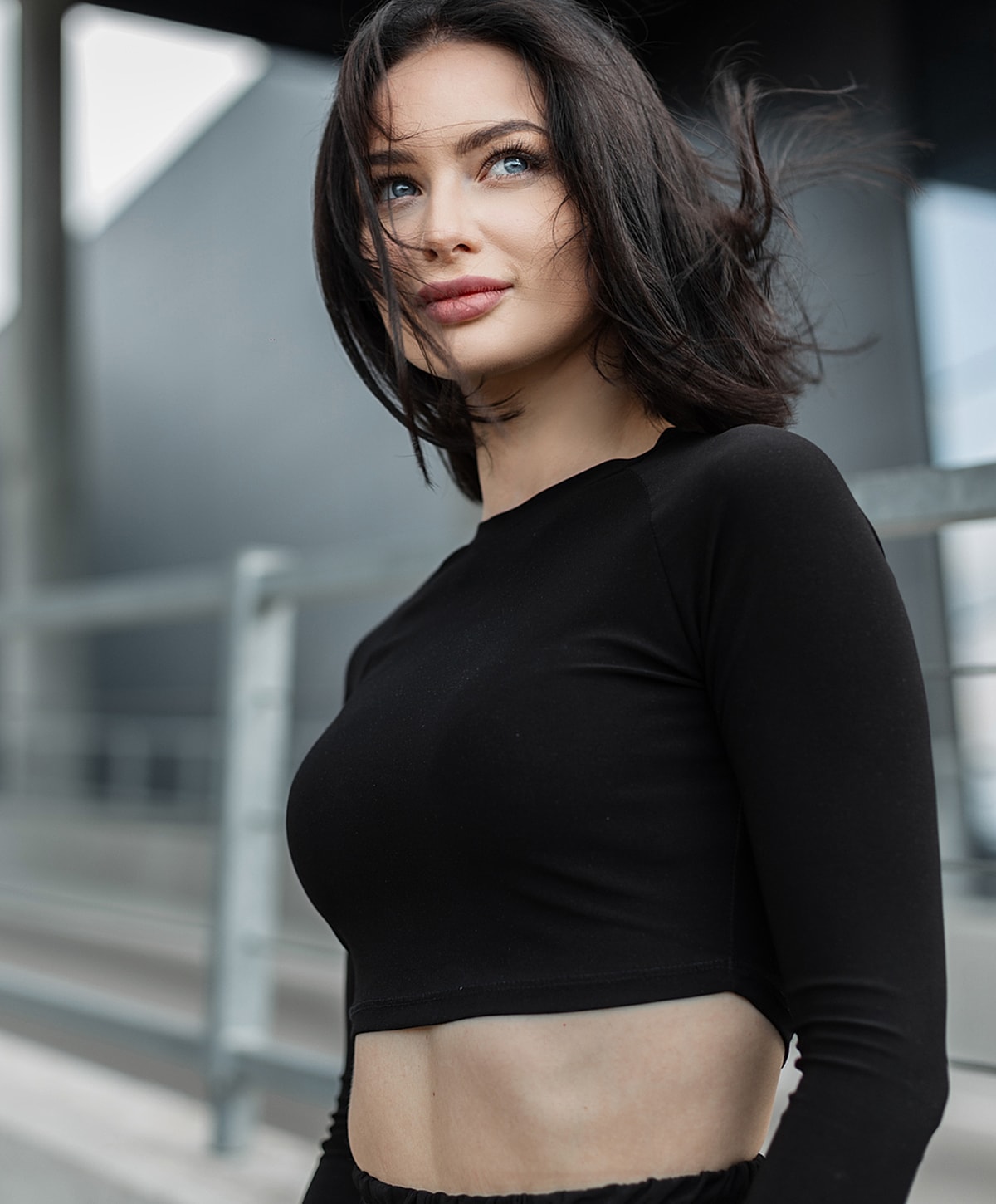 Woman with short hair in a stylish crop top.