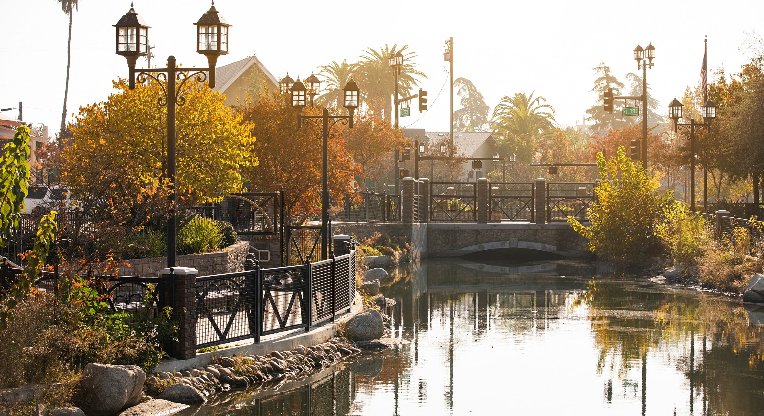 Scenic park view with water and trees.